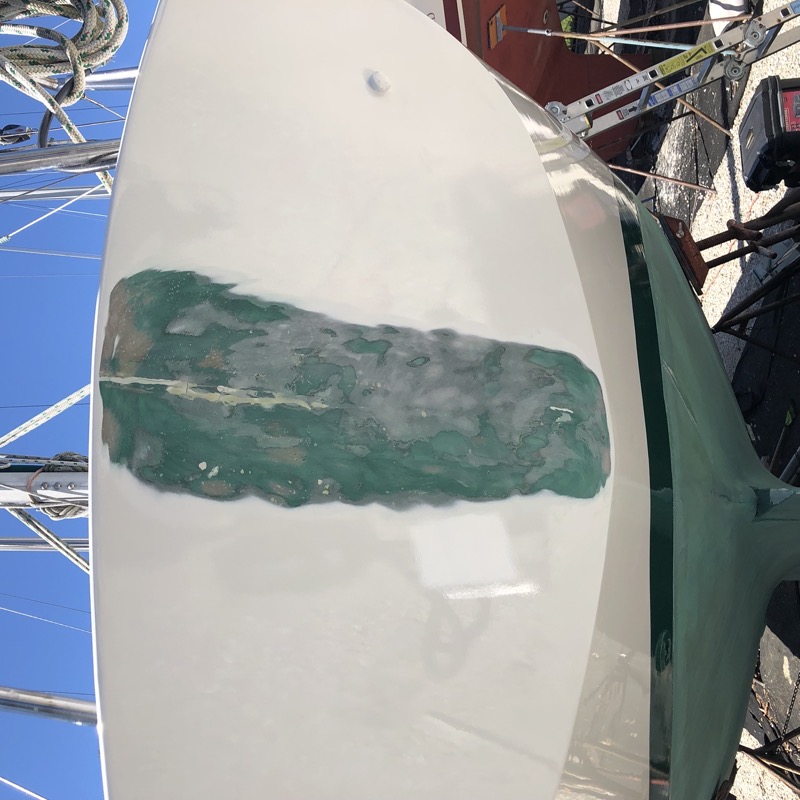 Transom with paint removed, exposing previous repair